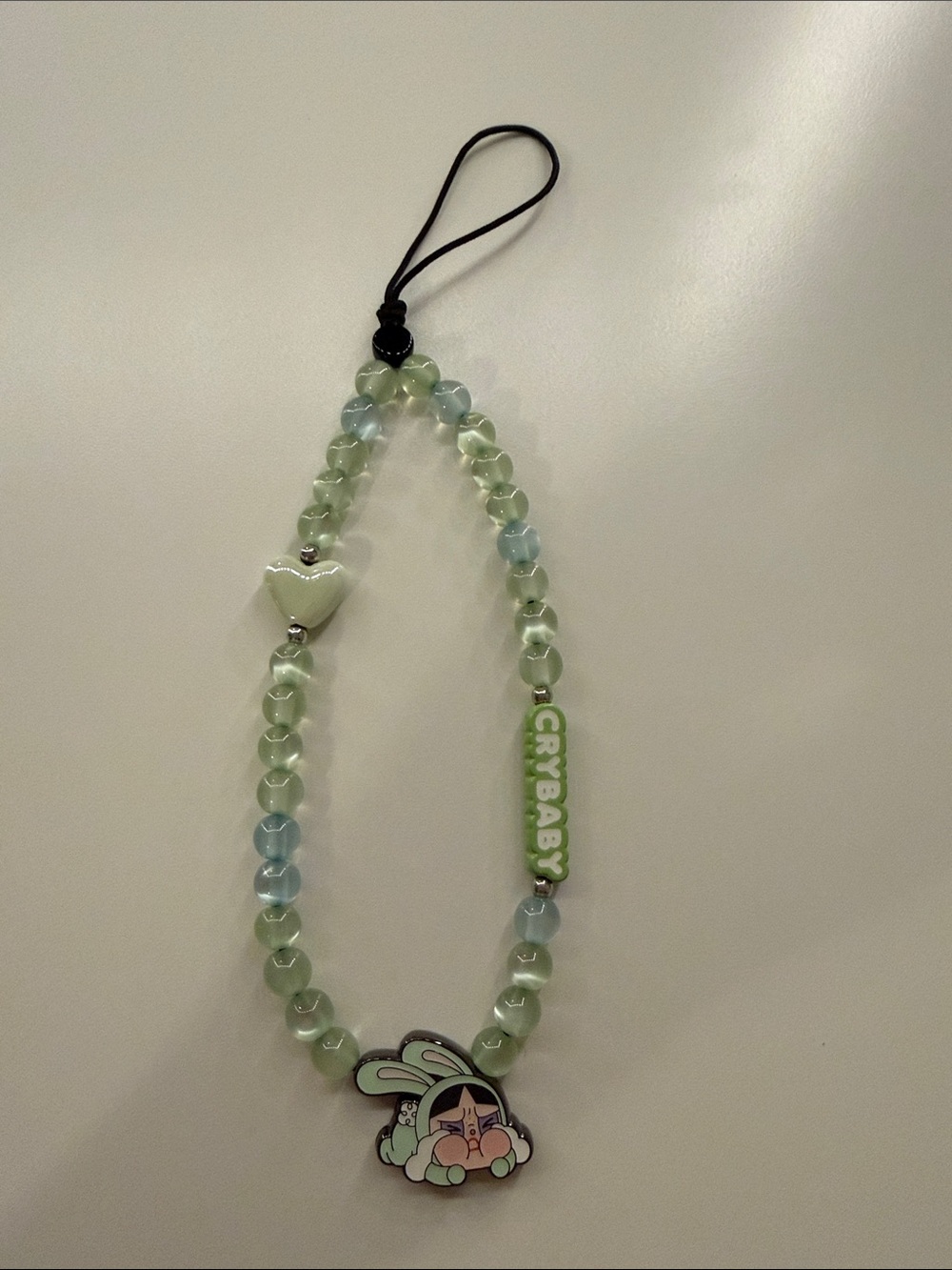 Green Beaded Phone Wristlet with 'Crybaby' Accent and Heart Charm